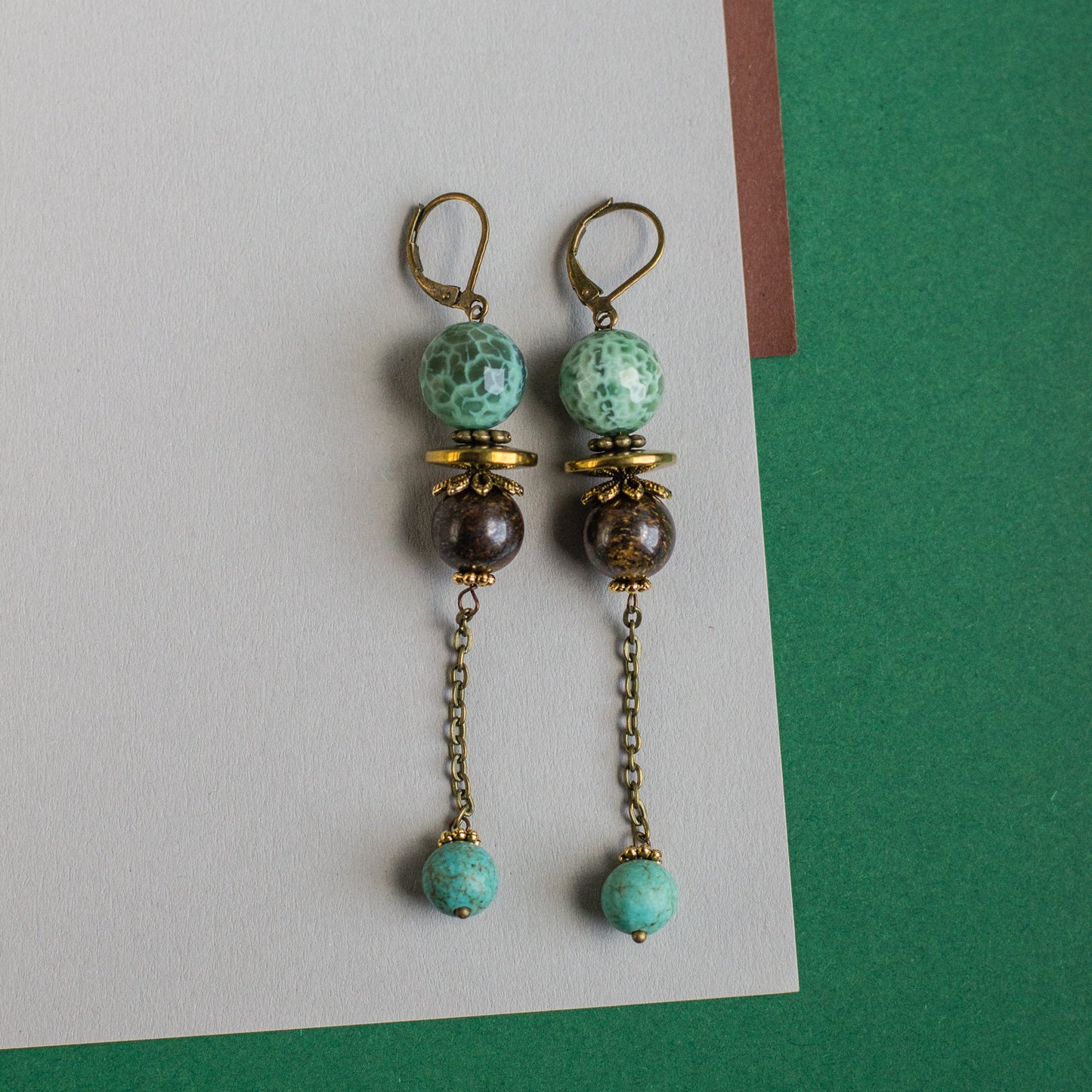 These simple yet beautiful green and brown dangle earrings are a perfect accent for any occasion, and a great gift idea.