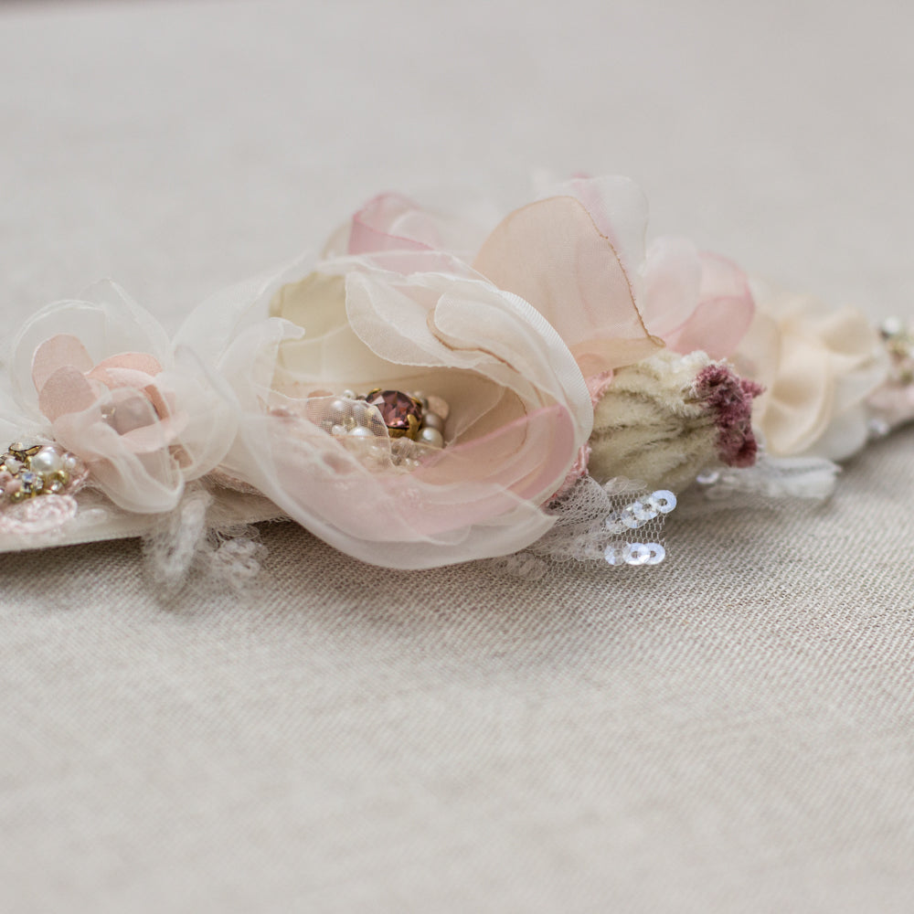 A unique handmade wedding dress belt sash features champagne, blush pink, dusty rose, beige accents. Floral design bridal sash belt is perfect for rustic, spring, or summer weddings. An online boutique with one-of-a-kind wedding accessories.