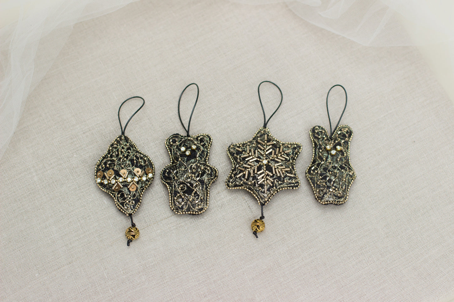 Set of four handmade Christmas ornaments. A gold & black Christmas tree decorations hand embroidered with crystals & seed beads, the back side finished with black velour. Jeweled Christmas ornaments.