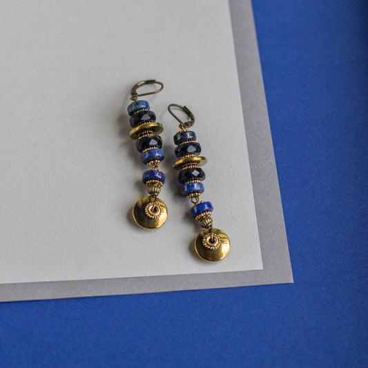 Find the perfect gift with these one-of-a-kind, handmade long-hanging earrings featuring beautiful blue, black, and gold rondelles.