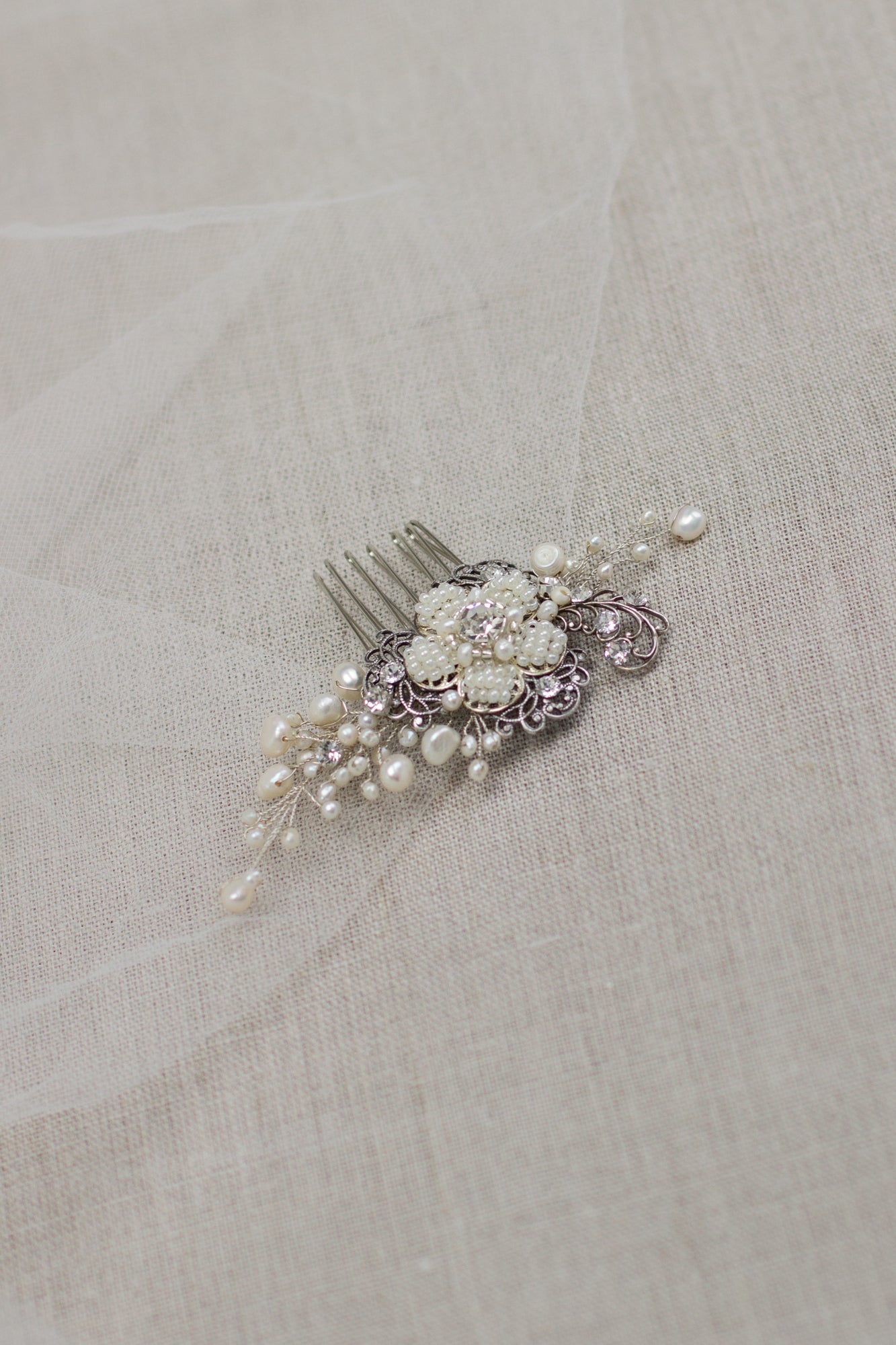 Check out our unique handmade bridal hair accessories at our online boutique in Europe. This beautiful one of a kind pearl hair comb, bridal hair adornment, crystal wedding headpiece feature floral motifs, pearl twigs decorated with crystals. Perfect for your special day. 