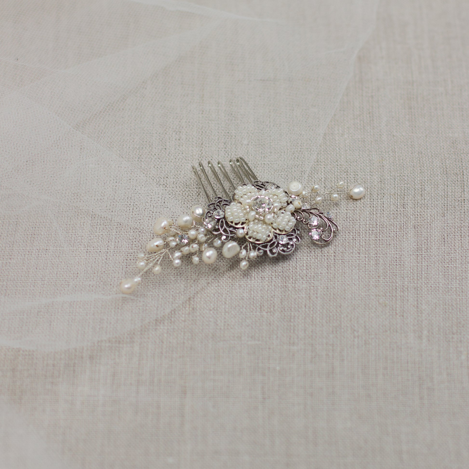 Check out our unique handmade bridal hair accessories at our online boutique in Europe. This beautiful one of a kind pearl hair comb, bridal hair adornment, crystal wedding headpiece feature floral motifs, pearl twigs decorated with crystals. Perfect for your special day. 