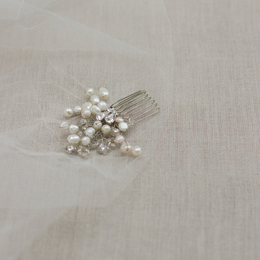Check out our unique handmade wedding hair accessories at online bridal boutique in Europe. One of a kind bridal hair comb. Small pearl wedding headpiece. Freshwater pearl hair comb. Wedding hair piece features pearl twigs. Hair adornment.
