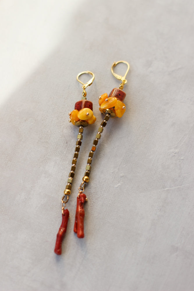 Long, light & bright unique fashion accessories. Amber earrings. Coral earrings. Geometric shapes jewelry. Gold, yellow, and red earrings. fashionable look for summer.