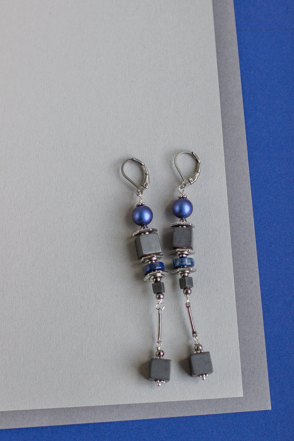Shop for long royal blue, gray, and silver Swarovski pearl earrings. Dangle drop earrings. Handmade fashion accessories that are unique. Geometric jewelry