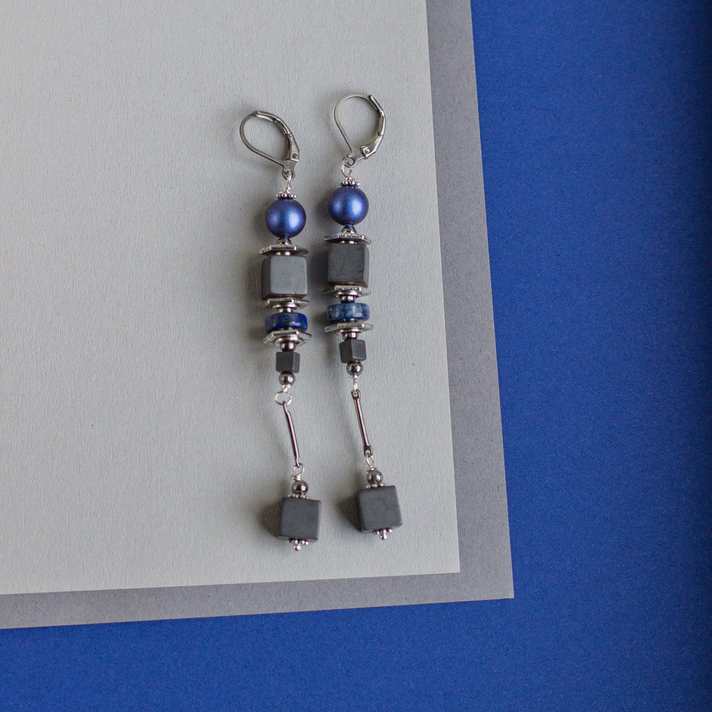 Shop for long royal blue, gray, and silver Swarovski pearl earrings. Dangle drop earrings. Handmade fashion accessories that are unique. Geometric jewelry