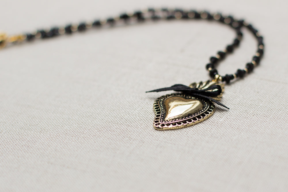 Sacred heart pendant necklace, handmade with black and gold accents. Burning heart necklace. A beautiful gift idea