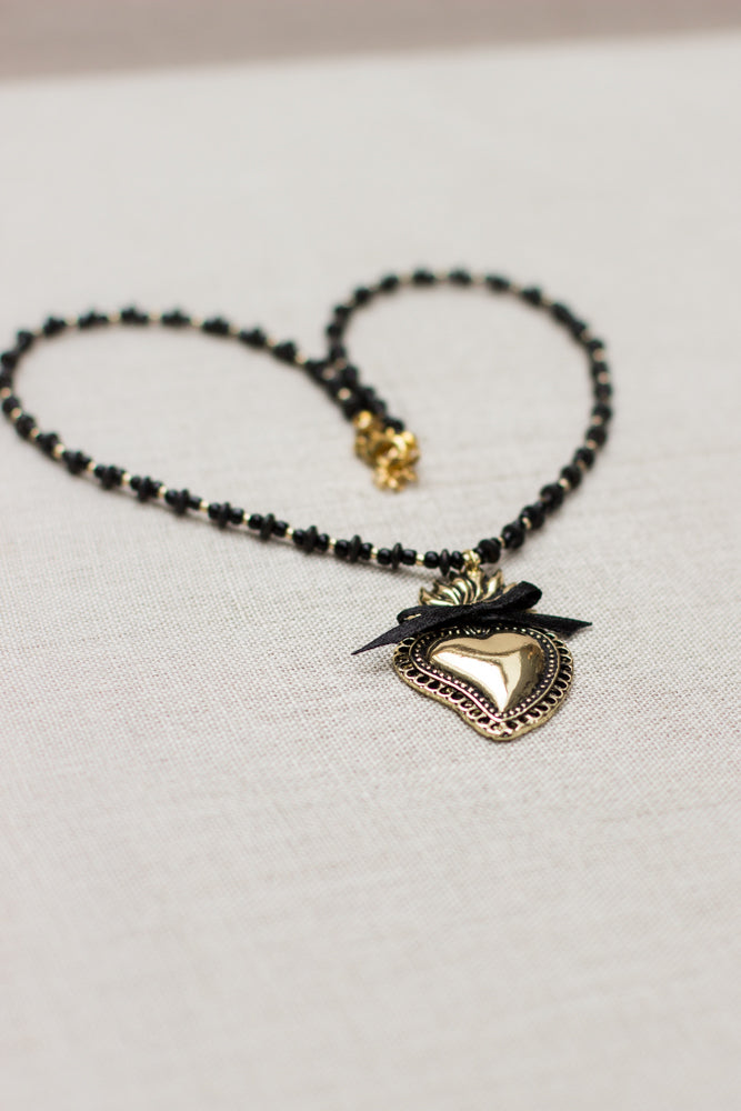 Sacred heart pendant necklace, handmade with black and gold accents. Burning heart necklace. A beautiful gift idea