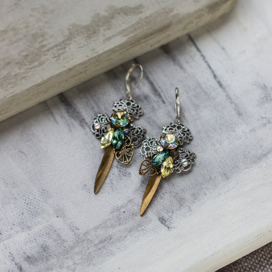 Shop elegant green, yellow, silver, and brass filigree earrings. Perfect for any occasion, these stylish dangle drop earrings add a touch of glamour to any outfit and make a great gift idea. 