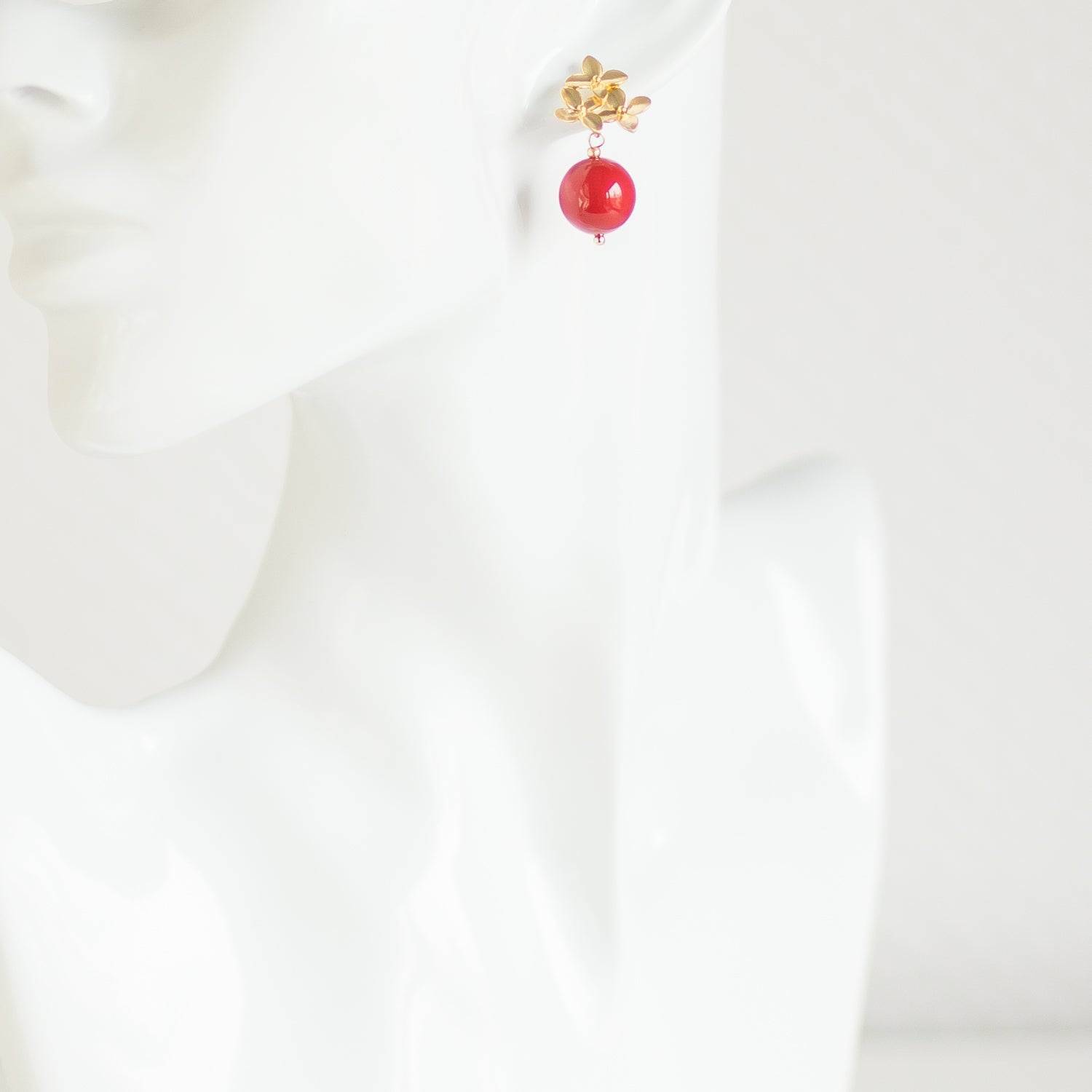 Small red Swarovski pearl earrings. Gold floral stud earrings. Elegant pearl accessories. Casual drop pearl earrings.