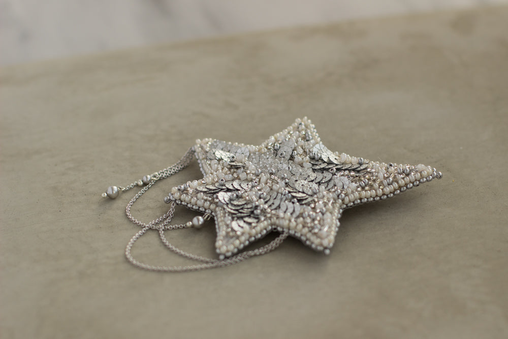 Shop women's jewelry at LeFlowers Bijouterie to discover unique handmade pieces for your wardrobe.  Star brooch. Embroidered jewelry. Gray star brooch. Gray brooch