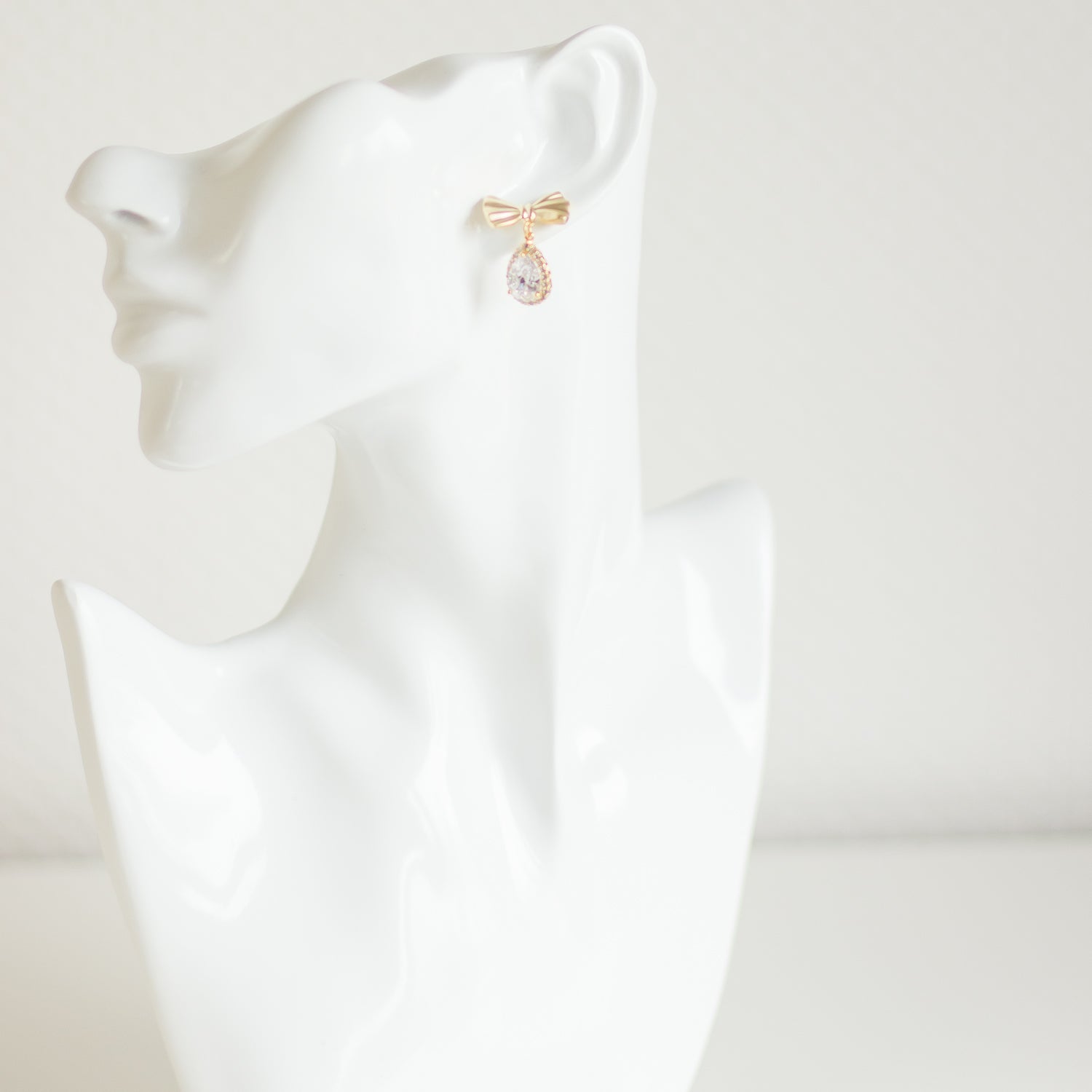 Stud earrings. Golden earrings. Bow earrings. Stylish earrings. Cubic zirconia earrings. Crystal jewelry. Handmade accessories